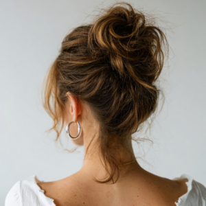Messy bun updo at Shape Hair Design in Teddington